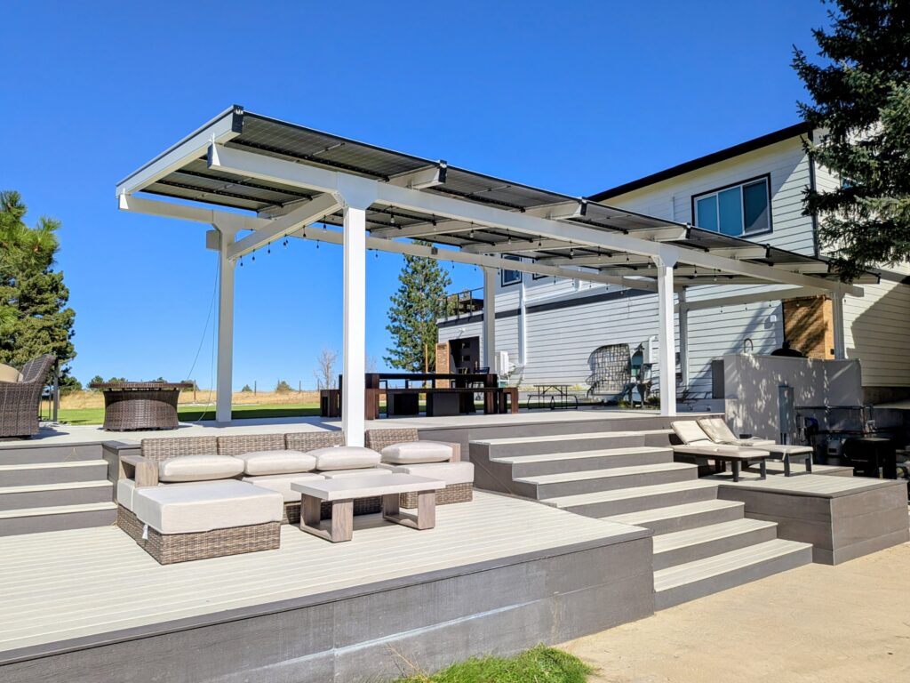 Solar pergola creating a covered outdoor patio and entertaining area