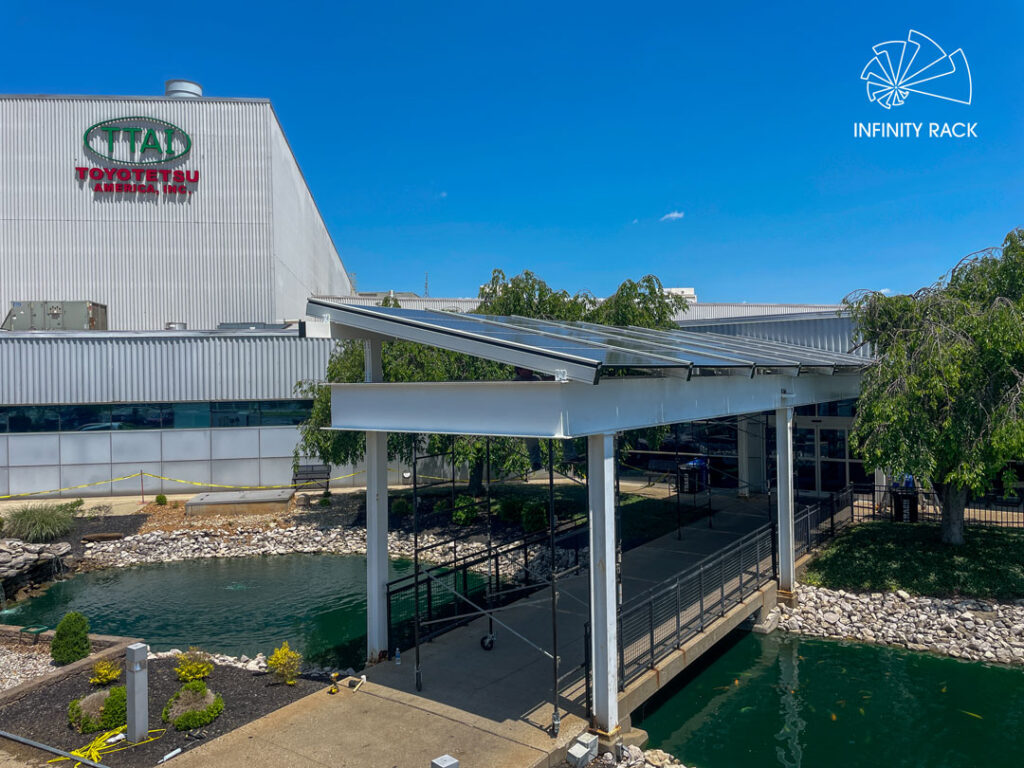 Solar canopy installed above a walkway at an industrial manufacturing facility
