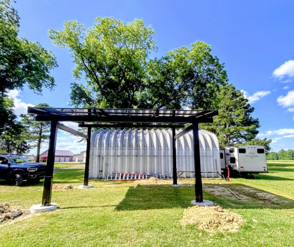 Aluminum solar pergola providing shade and renewable energy generation