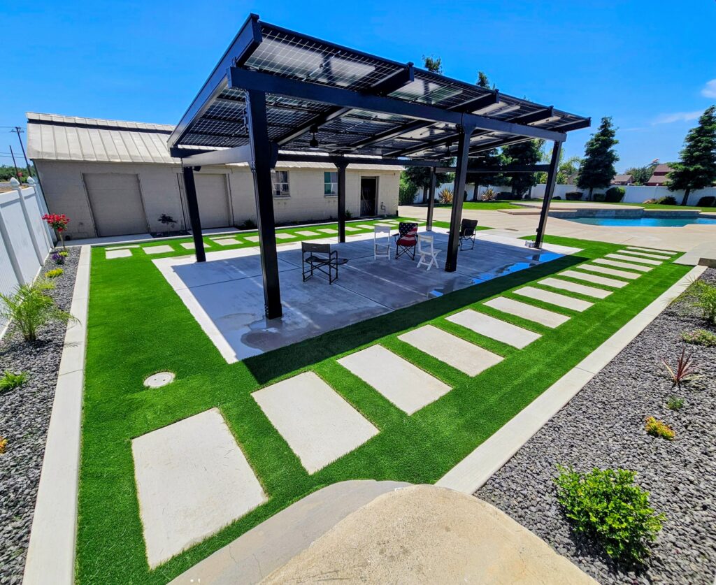 Homeowner DIY-installed solar pergola surrounded by manicured landscaping