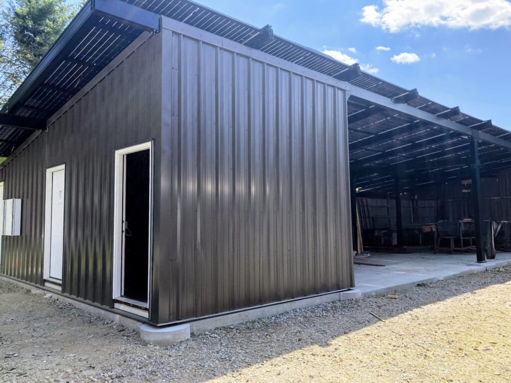 Solar-integrated garage structures providing covered parking and storage