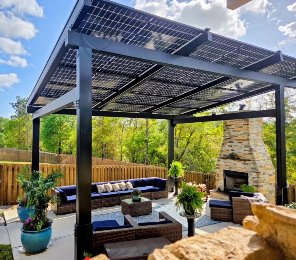 Solar pergola creating a covered outdoor living area with fireplace and seating