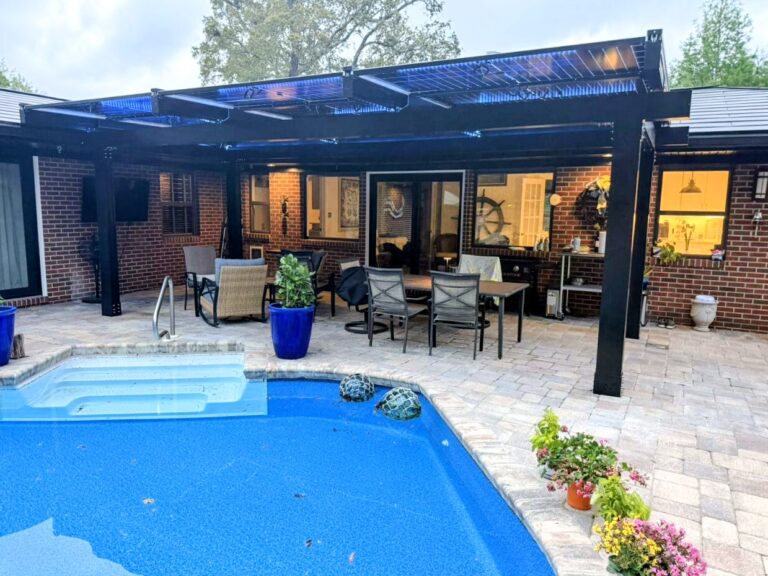 Solar pergola installed beside a residential swimming pool in Florida
